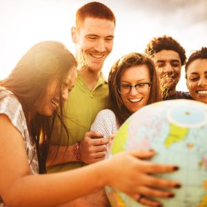 teenagers college student smiling with globe
